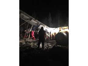RCMP say a plane with 25 people on board has crashed in northern Saskatchewan shortly after taking off around 6:15 p.m. Wednesday at the Fond du Lac airport. First responders work the crash scene near the Fond du Lac airport in a Wednesday, December 13, 2017, image posted to social media.