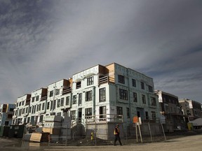 The Federal Court of Appeal is set to decide today whether Canada's largest real estate board must open up access to home sales data to its realtor members, which it could then share with the public online. A new townhouse complex is under construction in Toronto on Thursday, November 3, 2016. THE CANADIAN PRESS/Nathan Denette