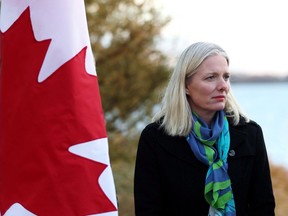 Environment Minister Catherine McKenna is seen on the shore of Lake Ontario in Toronto on Friday, Dec. 1, 2017, where she made a Great Lakes water-quality funding announcement. Canada's decentralized approach to putting a price on pollution is overly complex and will be difficult to implement the Organization for Economic Cooperation and Development says in a new report.
