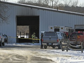 Fire officials investigate the cause of a fire at Folly Farm in Simsbury, Conn., Thursday, Dec. 28, 2017.  The owners of the Connecticut equestrian training and boarding farm said many horses died in the fire at their barn.