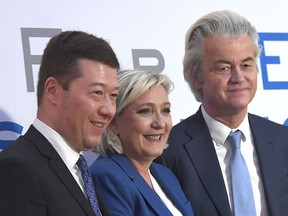 From the left founder and President of Czech Freedom and Direct Democracy  party Tomio Okamura, French politician and head  of the National Front, Marine Le Pen, and Dutch politician, founder and the current leader of the Party for Freedom Geert Wilders pose for photographers after a press conference  at a conference of European anti-migrant parties from the Europe of Nations and Freedom (ENF) Group in the European Parliament, in Prague, Saturday, Dec. 16, 2017.