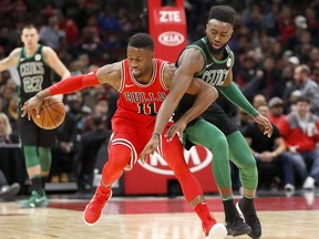 Boston Celtics' Jaylen Brown, right, pressures Chicago Bulls' David Nwaba during the first half of an NBA basketball game Monday, Dec. 11, 2017, in Chicago.