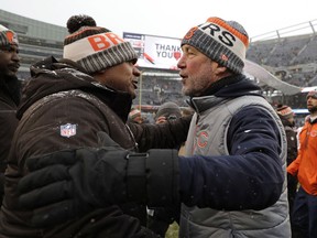 Cleveland Browns head coach Hue Jackson, left, talks with Chicago Bears head coach John Fox after an NFL football game in Chicago, Sunday, Dec. 24, 2017. Chicago won 20-3.