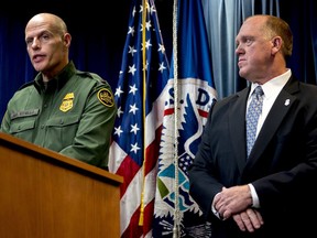U.S. Customs and Border Protection Acting Deputy Commissioner Ronald Vitiello, left, accompanied by Acting Director for U.S. Immigration and Customs Enforcement Thomas Homan, right, speaks at a Department of Homeland Security news conference at the Ronald Reagan Building in Washington, Tuesday, Dec. 5, 2017, to announce end-of-year numbers regarding immigration enforcement.
