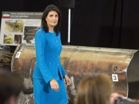 U.S. Ambassador to the U.N. Nikki Haley walks past recovered remains of an Iranian rocket during a press briefing at Joint Base Anacostia-Bolling, Thursday, Dec. 14, 2017, in Washington. Haley says "undeniable" evidence proves Iran is violating international law by funneling missiles to Houthi rebels in Yemen. Haley unveiled recently declassified evidence including segments of missiles launched at Saudi Arabia from Houthi-controlled territory in Yemen.