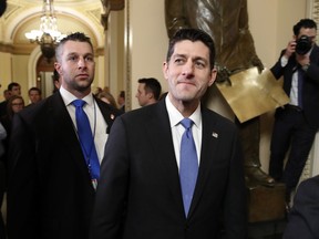House Speaker Paul Ryan of Wis., center, leaves the House Chamber after voting on the Republican tax bill, Tuesday, Dec. 19, 2017, on Capitol Hill in Washington. Republicans muscled the most sweeping rewrite of the nation's tax laws in more than three decades through the House.