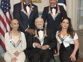 Front row from left, 2017 Kennedy Center Honorees Carmen de Lavallade, Norman Lear, and Gloria Estefan, back row from left, LL Cool J, and Lionel Richie are photographed following the State Department dinner for the Kennedy Center Honors, Saturday, Dec. 2, 2017, in Washington.