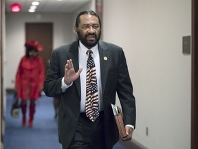In this photo from Wednesday, Nov. 29, 2017, Rep. Al Green, D-Texas, arrives for a Democratic Caucus meeting on Capitol Hill in Washington. The House has overwhelmingly voted to kill a resolution from Green to impeach President Donald Trump. The vote Wednesday was 364-58.