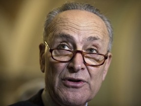 Senate Minority Leader Chuck Schumer, D-N.Y., speaks to reporters about the GOP tax bill following the Democratic Caucus weekly policy meeting, on Capitol Hill in Washington, Tuesday, Dec. 12, 2017.