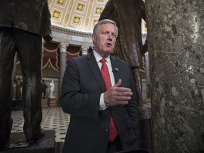 Rep. Mark Meadows, R-N.C., chairman of the conservative Freedom Caucus, speaks during a television news interview just before passage of the Republican tax reform bill in the House of Representatives, on Capitol Hill, in Washington, Tuesday, Dec. 19, 2017.