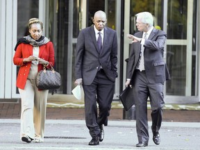 Former congressman William J. Jefferson, center, arrives for his sentencing hearing at Albert V. Bryan Courthouse in Alexandria, Va., Friday, Dec. 1, 2017. Federal prosecutors recommend former Louisiana congressman serve no more jail time now that many of the convictions against him have been overturned. William Jefferson garnered headlines in 2005 after he was caught hiding $90,000 in his freezer following a government sting.   (AP Photo/Sait Serkan Gurbuz)