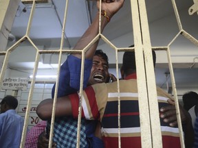 An unidentified relative of a stampede victim cries at the Chittagong medical hospital, in Chittagong, Bangladesh, Monday, Dec.18, 2017. Police in Bangladesh say at least 10 people have been killed and another 40 injured in a stampede at a jam-packed religious ritual for a popular mayor who died last week. (AP Photo)
