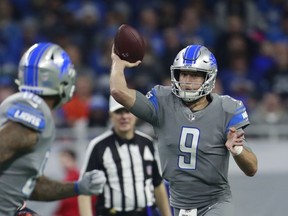Detroit Lions quarterback Matthew Stafford (9) throws to tight end Eric Ebron during the first half of an NFL football game against the Chicago Bears, Saturday, Dec. 16, 2017, in Detroit.