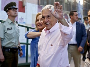 Former Chilean President and current presidential candidate Sebastian Pinera waves before voting during presidential elections runoff in Santiago, Chile, Sunday, Dec. 17, 2017. Chileans voters will decide Sunday whether to swing the world's top copper-producing country to the right or maintain its center-left path in a fiercely contested presidential runoff election.