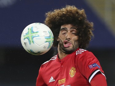 Machester United midfielder Marouane Fellaini takes a ball to the face against Real Madrid on Aug. 8.