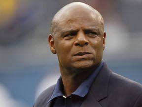 In this Dec. 2, 2012 file photo, Warren Moon watches warmups before an NFL game between the Chicago Bears and the Seattle Seahawks in Chicago.