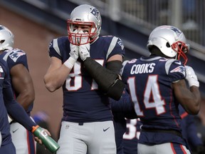 New England Patriots tight end Rob Gronkowski warms his hands during workouts before an NFL football game against the New York Jets, Sunday, Dec. 31, 2017, in Foxborough, Mass. Gronkowski wasn't targeted for a pass in an NFL game for the first time in his career.