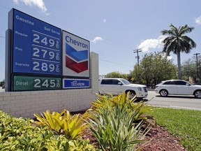 This Wednesday, May 3, 2017, photo shows a a sign with gas prices at a Chevron station in Miami. On Wednesday, Dec. 13, 2017, the Labor Department reports on U.S. consumer prices for November.