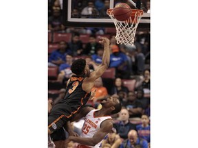 Florida's Jalen Hudson (3) shoots the ball over Clemson's Aamir Simms (25) during the first half of an NCAA college basketball game at the Orange Bowl Basketball Classic tournament Saturday, Dec. 16, 2017, in Sunrise, Fla.