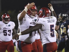 Florida Atlantic running back Devin Singletary (5) celebrates his touchdown in the second quarter of an NCAA college football game against Akron in the Boca Raton Bowl in Boca Raton, Fla., Tuesday, Dec. 19, 2017.