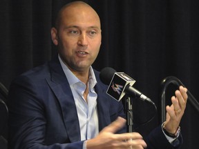 FILE - In this Oct. 3, 2017, file photo, Miami Marlins part owner Derek Jeter speaks during a press conference in Miami. Jeter is trying to revive a moribund Marlins franchise, and so far the former New York Yankees captain appears out of his league as a CEO.