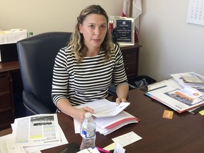 In this Dec. 21, 2017 photo, Florida State Rep. Emily Slosberg poses for a photo at her office in Deerfield Beach, Fla. Slosberg is the lead sponsor of a bill that would strengthen the state's ban on texting while driving. Florida  is one of the last states to not fully ban texting while driving.