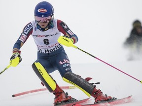 Mikaela Shiffrin of the United States clears a gate during the women's slalom of the Alpine combination race at the Alpine Ski World Cup, in St. Moritz, Switzerland, Friday, Dec, 8, 2017.