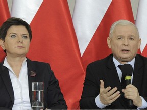 FILE - In this Dec. 21, 2016 file photo Jaroslaw Kaczynski, chairman of the populist ruling Law and Justice party, speaks during a press conference with Poland's Prime Minister Beata Szydlo, left, in Warsaw, Poland. Szydlo sent a tweet early Tuesday, Dec. 5, 2017 that seems to read like a farewell, amid rumors in Warsaw that she might be replaced by Finance Minister Mateusz Morawiecki.