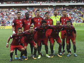 FILE - In this Thursday Aug. 31, 2017 filer Portugal players pose for photos before the World Cup Group B qualifying soccer match between Portugal and Faroe Islands at the Bessa Stadium in Porto, Portugal. (AP Photo/Paulo Duarte, File)