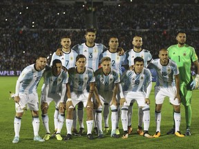 In this photo taken on Thursday, Aug. 31, 2017 Argentina team poses for photos before a 2018 World Cup qualifying soccer match against Uruguay in Montevideo, Uruguay.(AP Photo/Natacha Pisarenko)