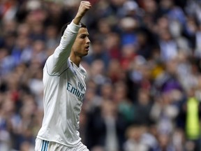 Real Madrid's Cristiano Ronaldo celebrates after scoring his side's third goal against Sevilla during the Spanish La Liga soccer match between Real Madrid and Sevilla at the Santiago Bernabeu stadium in Madrid, Saturday, Dec. 9, 2017. Ronaldo scored twice in Real Madrid's 5-0 victory.