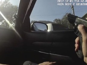 FILE - In this Dec. 1, 2017 file image taken from a San Francisco Police Department officer's body camera video, an officer aims his weapon before a fatal shooting in the Bayview neighborhood of San Francisco. A Northern California woman has filed a civil rights lawsuit alleging a San Francisco police rookie wrongfully shot and killed her unarmed son while he fled from a stolen van he was driving earlier this month. Lawyers for the mother of 42-year-old Keita O'Neil filed the lawsuit Tuesday, Dec. 19, 2017, in federal court in San Francisco. (San Francisco Police Department via AP, File)