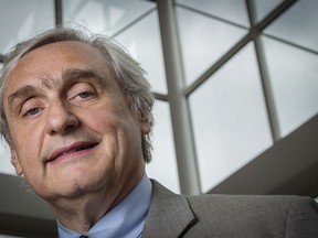 FILE - In this July 24, 2014, file photo, then-Chief Judge of the U.S. Court of Appeals for the Ninth Circuit Alex Kozinski poses for a portrait in the lobby of a Washington office building. Six women who served as clerks or externs at the U.S. 9th Circuit Court of Appeals allege to The Washington Post that judge Alex Kozinski subjected them to inappropriate sexual comments or conduct, including asking them to watch pornography in his chambers, the newspaper reported Friday, Dec. 8, 2017.
