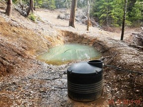 In this undated photo provided by the California Department of Fish and Wildlife, is a tank and water runoff from a marijuana farm on a private land grow in the Mattole River watershed in Northern California. However many of California's pot growers come off the black market when recreational marijuana becomes legal here next month, legalization will bring environmental rules and regulators to an industry notorious for bulldozing forest, draining streams, and strewing banned poisons. Plot for plot, according to a study published this year, illegal marijuana cultivation does more damage than commercial logging in remote forests of northern California, the hub for the U.S. cannabis industry. (California Department of Fish and Wildlife via AP)