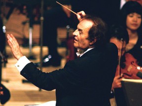 In this June 19, 2003 file photo, conductor Charles Dutoit performs with NHK Symphony Orchestra in Tokyo, Japan. Four women have accused Dutoit of sexual misconduct that allegedly occurred on the sidelines of rehearsals or performances with some of America's great orchestras. The 81-year-old is the artistic director and principal conductor at London's Royal Philharmonic Orchestra. (Kyodo News via AP)