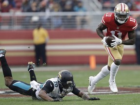 San Francisco 49ers wide receiver Marquise Goodwin (11) runs past Jacksonville Jaguars cornerback Jalen Ramsey (20) during the first half of an NFL football game in Santa Clara, Calif., Sunday, Dec. 24, 2017.