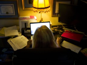 In this Monday, Dec. 4, 2017, photo, Gail Trauco, owner of The PharmaKon, looks over insurance documents on her computer in Peachtree City, Ga. Many small business owners like Trauco are facing rate increases running into double-digit percentages or dramatically reduced coverage, or both.