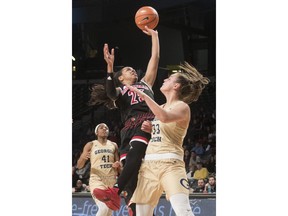 Louisville guard Asia Durr (25) shoots as Georgia Tech guard Francesca Pan (33) defends during the first half of an NCAA college basketball game, Thursday, Dec. 28, 2017, in Atlanta.