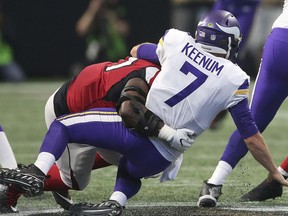 Atlanta Falcons defensive tackle Grady Jarrett (97) sacks Minnesota Vikings quarterback Case Keenum (7) during the first half of an NFL football game, Sunday, Dec. 3, 2017, in Atlanta.
