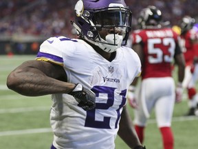 Minnesota Vikings running back Jerick McKinnon (21) celebrates his touchdown against the Atlanta Falcons during the first half of an NFL football game, Sunday, Dec. 3, 2017, in Atlanta.