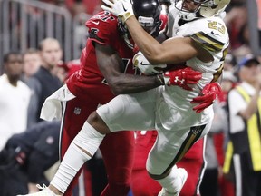 New Orleans Saints cornerback Marshon Lattimore (23) runs back an interception as Atlanta Falcons wide receiver Julio Jones (11) makes the tackle tries to make the tackle during the first half of an NFL football game, Thursday, Dec. 7, 2017, in Atlanta.