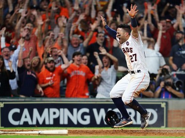Houston Astros infielder Jose Altuve scores the winning run in Game 2 of the ALCS against the New York Yankees on Oct. 14.
