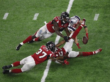 New England Patriots receiver Julian Edelman makes a late circus catch in the Super Bowl in Houston on Feb. 5.