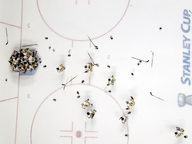 Pittsburgh Penguins players storm the ice after winning the Stanley Cup in Nashville on June 11.