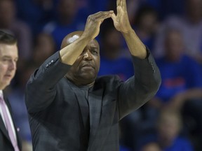 Florida State head coach Leonard Hamilton signals for a time out during the first half of an NCAA college basketball game against Florida in Gainesville, Fla., Monday, Dec. 4, 2017.