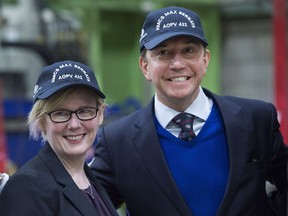 Public Services Minister Carla Qualtrough, left, and Treasury Board President Scott Brison sport ball caps at an Irving Shipbuilding ceremony where the first piece of steel was cut on the third Arctic patrol vessel, named in honour of Chief Petty Officer Max Leopold Bernays, in Halifax on Tuesday, Dec. 19, 2017. Irving is building five to six Arctic patrol vessels under Ottawa‚Äôs national shipbuilding strategy.