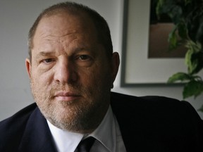 In this Nov. 23, 2011 file photo, film producer Harvey Weinstein poses for a photo in New York.