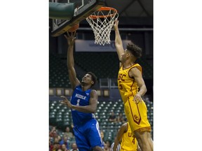 Middle Tennessee forward Brandon Walters (1) shoots a layup while defended by Southern California forward Bennie Boatwright (25) during the first half of an NCAA college basketball game at the Diamond Head Classic tournament Saturday, Dec. 23, 2017, in Honolulu.