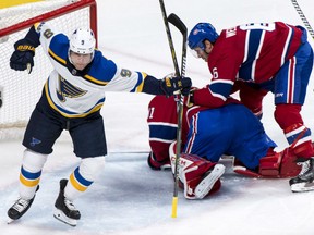 St. Louis Blues' Scottie Upshall celebrates his goal past Canadiens netminder Carey Price as defenceman Shea Weber looks on during the second period on Tuesday night in Montreal.