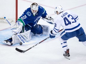 Canucks goalie Jacob Markstrom stops Toronto Maple Leafs' Nazem Kadri during the second period of their game in Vancouver, on Saturday.